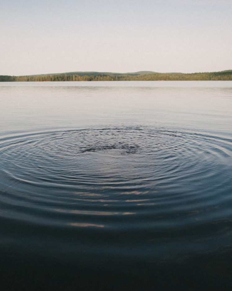 Water ripples on a still lake.